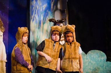 Preschool age kids performing in a theater play. Preschool age kids performing in a theater play.